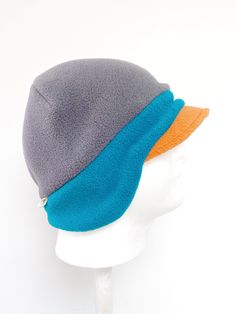 "OMG!!!! Never knew a hat that would fit perfect, is very comfortable, soft, and keeps my ear warm too...all in one, wow!" - Gail, TX Women's Fleece Beanie Hat A NEW Trio of Colors Hat! This anti-pill fleece newsboy hat is designed with function, style and you in mind. Need more color in your life? Yes! Triple your fun in the new fleece hat color combo in a pre-selected trio of yummy fleece colors! Whether you're shoveling the driveway or tackling the big grocery day on a blustery winter day - d Adjustable Hats With Fleece Lining And Ear Flaps, Adjustable Fleece-lined Beanie For Winter, Fleece-lined Beanie Cap, One Size Fits Most, Beanie Earflap, Adjustable Fleece-lined Hat For Outdoor, Fleece-lined Ear Flaps Hat For Outdoor, Bucket Hat Winter, Winter Bucket Hat, Fleece Beanie