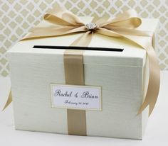 a white box with a bow and label on it