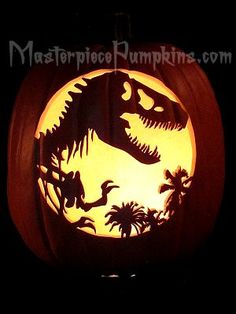 a pumpkin carved to look like a dinosaur