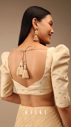 Cream blouse in brocade silk with woven polka dots and puffed shoulders.
It is crafted with sweetheart neckline, half sleeves and curved hem.
This piece comes with padding and back hook closure along with tassel dori tie up. Sweetheart Neckline Blouse Indian, Puffed Sleeves Blouse Saree, Boat Neck Blouse Design, Half Saree Lehenga, Backless Blouse Designs, Wedding Saree Blouse Designs, Lehnga Dress, New Blouse Designs, Blouse Designs Indian