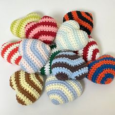 several crocheted balls sitting on top of each other