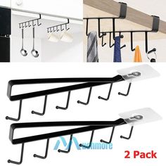 four hooks are hanging on the wall and two hangers are attached to each other