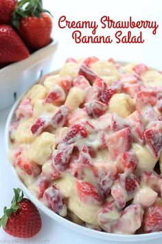 strawberry banana salad in a white bowl with strawberries