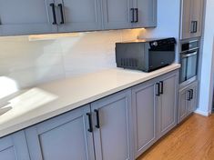 a microwave oven sitting on top of a kitchen counter