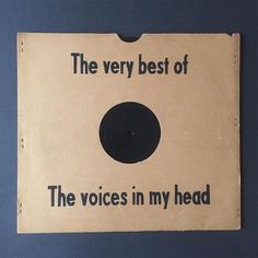 the very best of the voice's in my head sign is hanging on the wall