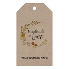 a tag that says, handmade love with flowers and leaves around it on a white background