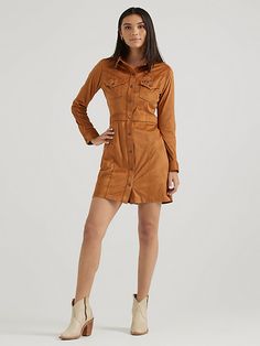 With a luxurious look and feel, the Women’s Wrangler Retro® Sueded Western Snap Shirt Dress will become your first pick for every special occasion. This vintage-inspired dress is crafted from a soft fabric blend with just a little stretch for extra comfort. It features all the Western-inspired details, including chest flap pockets with our signature ‘W’ stitching, pointed yokes from front to back, a banded waist for a flattering fit, and branded hardware for authenticity. Wrangler Dress, Wrangler Denim Dress, Button-up Denim Dress With Snap Buttons, Brown Button-up Dress With Button Cuffs, Brown Button-up Shirt Dress For Daywear, Knee Sleeves, Retro Women, Dress Shirts For Women, Vintage Inspired Design