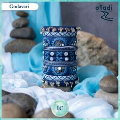 Godavari plays a big role for water energy and also a source to so many dams, so this set is designed to show dam and on the side windmill kind of design are made. Navratri Bangles Handmade, Navratri Jewellery, Hand Embroidered Jewelry, Textile Earrings, Silk Bangles