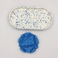 a blue and white object sitting on top of a table