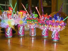 candy bar bouquets in cans on a dining room table