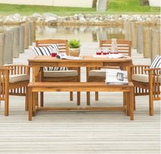 a wooden table sitting on top of a wooden pier