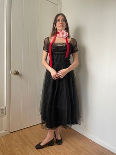 Condition: Great, the tulle is a bit brittle, but the dress is still entirely wearable.  Fits like a small, please see measurements for exact details----> Bust 17 Waist 12 Hips 18 Shoulder to Waist 15 Waist to Hem 31 Model wears a size XS/S and is 5'2. All measurements are taken flat in inches! When considering fit, compare it to a garment you own that fits well. For waist and hip measurements, double it to get the full circumference.  *All items are vintage and pre-loved. All major flaws are listed, but small blemishes like loose stitches and buttons may not be in the item description as they are to be expected when purchasing vintage items.  **We do not accept returns unless you believe that item was misrepresented in our shop. Please message us and ask questions! We would love to take t Elegant Tulle Costume Dresses, Elegant Tulle Dresses For Costume Events, Elegant Tulle Dresses For Costume, Vintage Tulle Dress For Formal Occasions, Fitted Vintage Tulle Skirt Dress, Fitted Vintage Tulle Dress, Vintage Organza Prom Dress, Costume Dress With Fitted Bodice In Tulle, Vintage Fitted Tulle Dress