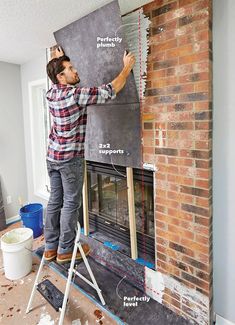 a man standing on top of a ladder next to a brick fireplace with the words fire safety written on it