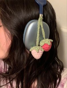 a close up of a person wearing headphones with an object attached to their ear