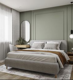 a bedroom with green walls and a bed in the middle, along with a mirror on the wall