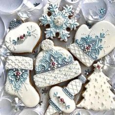 several decorated heart shaped cookies sitting on top of a table