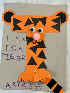 a paper cut out of a tiger with the words it's for tiger