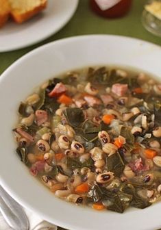 a white bowl filled with beans and vegetables