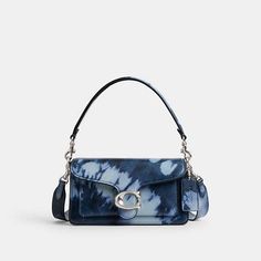 A modern take on an archival 1970s Coach design, our structured Tabby shoulder bag is crafted of smooth leather printed with our sophisticated spin on a classic tie-dye pattern. Smaller than the 26, the petite 20 features two detachable straps to carry by hand, style as a short shoulder bag or wear crossbody. It’s finished with our Signature hardware for an iconic touch. Coach Tabby Shoulder Bag, Tabby Shoulder Bag, Coach Tabby, Hand Style, Structured Bag, Back Bag, Signature Hardware, Backpack Tote Bag, Purse Accessories