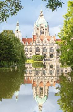 a large building sitting on top of a lake