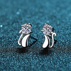 These unique stud earrings feature a cute kitten shape and are sure to please any cat lover. Crafted of Moissanite with an S925 finish, they are the perfect way to add a polished bit of fun to any outfit. Perfect for groovy looks, they always stay in style and are sure to dazzle. Order these Moissanite Earrings at an excellent price for yourself or indulge her on a particular day. Deluxe Gift Box included. GRA Certificate is unavailable as each Moissanite is under 0.5ct. Contact us if you want t Unique Studs, Stud Earrings Unique, Cat Earrings Studs, Stud Earrings For Men, Boys Jewelry, Sterling Silver Cat, Moissanite Earrings, Cz Stud Earrings, Stone Setting