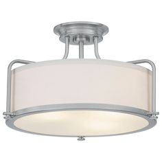 a semi flush ceiling light with a white shade