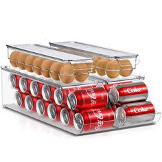 the coca - cola machine has six cans of eggs in it and is ready to be filled