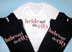 two bride and the city t - shirts sitting next to each other on a blue background