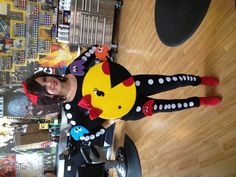 a woman is dressed up as a pikachu in a hairdressing shop