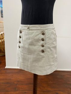 This little skirt is beautifully made in a cotton ticking fabric, and has lovely pocket and button detail.  It is mostly cotton with 3% elastane, and is a French size 40 (UK 12). Waist 85cm Length from waist to hem 40cm Cotton Skort For Workwear, Cotton Mini Skort For Workwear, Short Cotton Cargo Skirt For Spring, Spring Cotton Mini Skirt With Pockets, Relaxed Cotton Skort Of Short Length, Cotton Mini Skirt For Work, Fitted Cotton Mini Skirt With Pockets, Short Length Cotton Skort With Relaxed Fit, Cotton Mini Skirt With Lining