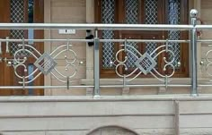 an iron balcony railing with decorative designs on it