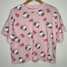 New Without Tags, Still Has The Plastic Thing From The Tag Hello Kitty By Sanrio Size Xl Short Sleeve Crewneck T-Shirt Light Pink With Hello Kitty Print And In Cursive All Over 50% Cotton 50% Polyester Cute Printed Pink Top, Cute Pink Printed Tops, Hello Kitty Y2k Summer Top, Red Cartoon Print Top For Spring, Pink Y2k Printed Tops, Y2k Pink Printed Tops, Pink Y2k Style Printed Tops, Pink Printed Y2k Tops, Playful Red Tops For Loungewear