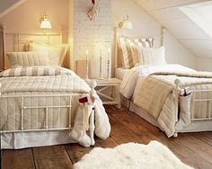 there are two beds in this attic bedroom