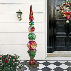 a christmas decoration is displayed in front of a door