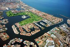 an aerial view of a city with lots of water