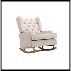 a white rocking chair with buttons on the back and seat upholstered in beige fabric