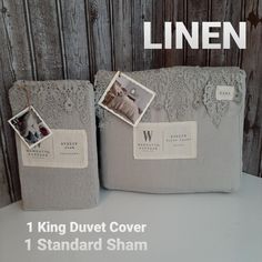 two gray linen storage bins with pictures on them and the words linen written in white