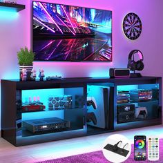 the entertainment center is lit up with neon lights and remote controls, along with other accessories