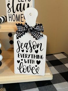 a wooden sign that says season everything with love on the front and back of it