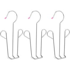 four metal hooks with pink handles on them