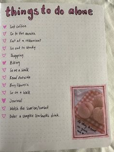 an open notebook with things to do along the page and a pink teddy bear on it