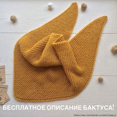 a yellow knitted hat with a bow on it