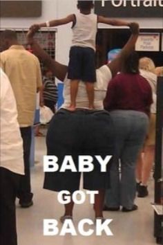 a group of people standing around each other in a room with the words baby got back on it