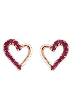 A 14K rose gold pair of stud earrings in a romantic heart shape are elevated further by round-cut rubies. 1/4" drop 0.16 ctw 14K rose gold/ruby Imported Rose Gold Heart Earrings For Valentine's Day Formal, Red Heart Jewelry, Ruby Heart, Romantic Heart, Heart Stud Earrings, Effy Jewelry, Heart Studs, Heart Earrings Studs, Watches Jewelry