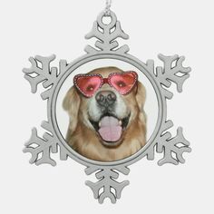 a golden retriever dog wearing sunglasses and snowflakes christmas ornament