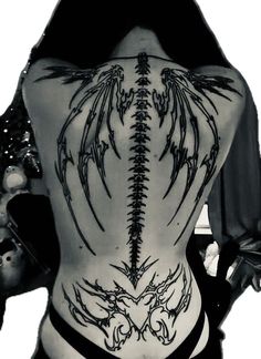 the back of a woman with tattoos on her body