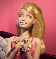 a barbie doll is sitting on a couch with her eyes closed and hands clasped to her chest