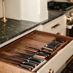 a drawer that has knives inside of it