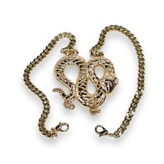 Add an edge of sophistication to your look with the Python Bracelet. This bold snake bracelet features a coiled serpent centerpiece, meticulously crafted with intricate detailing that symbolizes power and transformation. Made with a sleek shiny finish, this bracelet is designed to make a statement. The unique double-clasp design ensures a secure and comfortable fit while adding versatility to the piece. Perfect for both day and night, the serpent bracelet brings an element of fierce elegance to any outfit. Its timeless design and attention to detail make it an essential addition to any jewelry collection. Exposure to the salt from sweat can cause your pieces to become dull. Be mindful that perfume, hairspray and hand lotions may tarnish your gold filled jewelry due to the harsh chemicals t Serpent Bracelet, Halo Jewelry, The Serpent, Snake Bracelet, Hand Lotion, Gold Filled Jewelry, Polish Jewelry, Day And Night, Badger