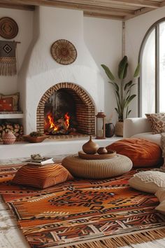 a living room filled with furniture and a fire place in the middle of the room